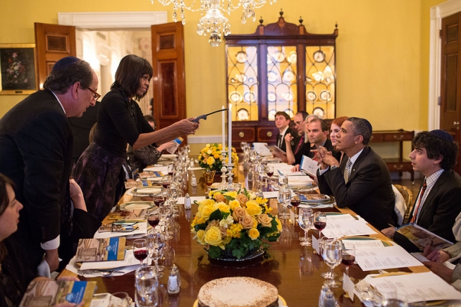 US President Barack Obama and First Lady Michelle Obama seen hosting a previous Passover Seder for family, staff and friends in the Old Family Dining Room of the White House. (Official White House Photo/Pete Souza)