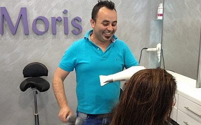 Hairdresser Moris Shokrun is calling Bibi on a purple rinse with a daily blowdry (photo credit: Jessica Steinberg/Times of Israel)