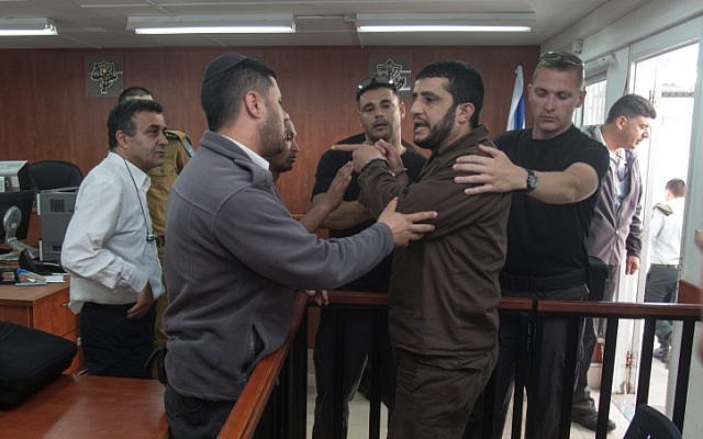 Wa'al al-Arjeh, at the Ofer military court in early April, was convicted on two counts of murder for hurling the stones that killed Asher and Yonatan Palmer (Photo credit: Flash 90)