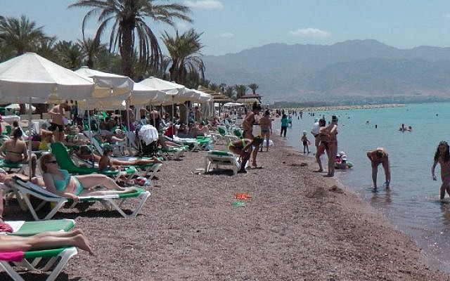 Local and foreign tourists sunbathe in the resort city of Eilat. (Illustrative photo credit: Flash90)