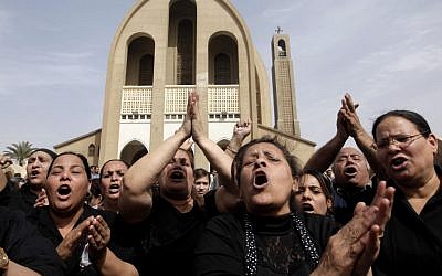 Egyptian Christians chant anti-Muslim Brotherhood slogans following a funeral service at the Saint Mark Coptic cathedral in Cairo, Egypt, Sunday, April 7, 2013. (photo credit: AP/Amr Nabil)