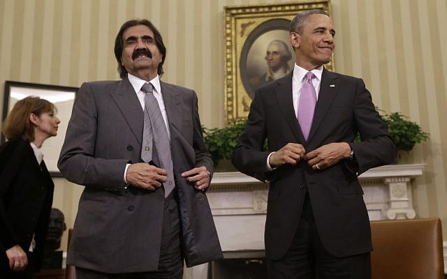 US President Barack Obama, with Sheik Hamad bin Khalifa Al Thani of Qatar, following their meeting in the Oval Office of the White House in Washington, Tuesday, April 23, 2013. (photo credit: AP/Pablo Martinez Monsivais)