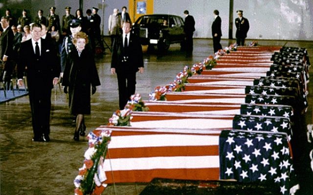 American ex-president Ronald Reagan and his wife, Nancy, view the caskets of American diplomats killed in the 1983 bombing of the US Embassy in Beirut, Lebanon. (Courtesy Ronald Reagan Presidential Library)
