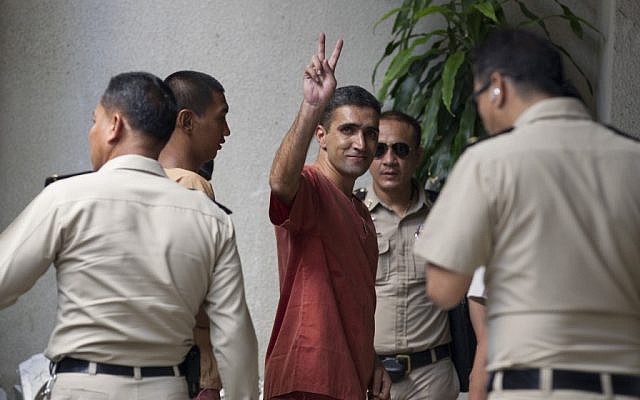 Iranian bombing suspect Mohammad Kharzei gestures upon arriving at the South Criminal Court in Bangkok, Thailand, on Friday. (photo credit: AP/Sakchai Lalit)