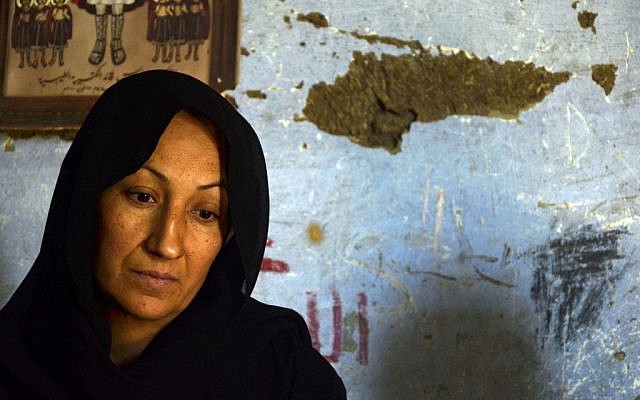The mother of 24-year-old school teacher Dimyana Abdel-Nour, who is accused of insulting Islam while teaching fourth graders history of religions, talks about her daughter in her home in southern Egypt's ancient city of Luxor, Egypt, Thursday, May 16, 2013. (photo credit: AP/Ibrahim Zayed)