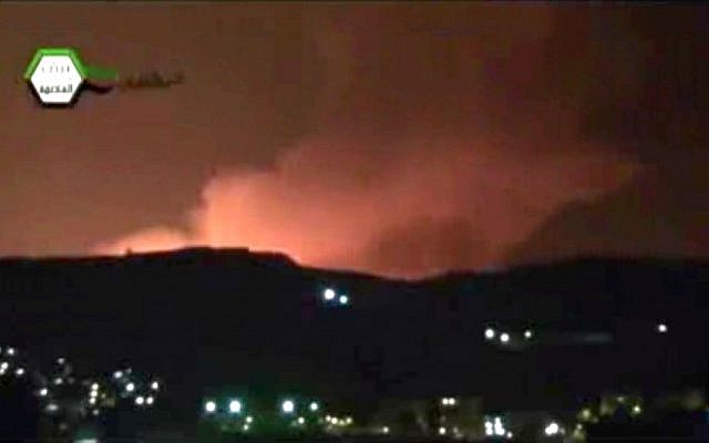 A screenshot showing smoke and fire filling the skyline over Damascus, Syria, early Sunday. (photo credit: AP/Ugarit News)
