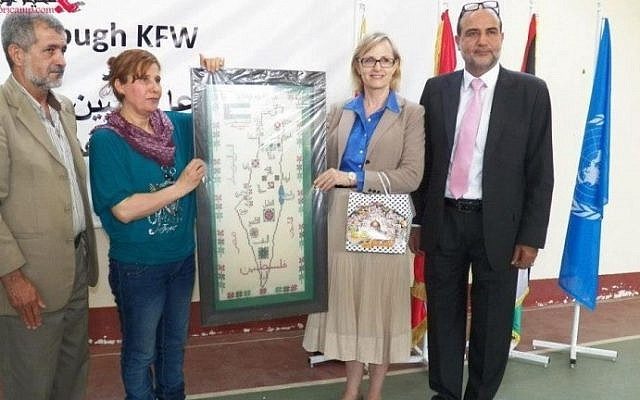 UNRWA's Ann Dismorr (second from right) holds the Israel-less map. (photo credit: screen capture/pn-news.net)