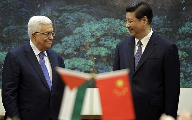 China's President Xi Jinping (right), and his Palestinian counterpart, Mahmoud Abbas, attend a signing ceremony at the Great Hall of the People in Beijing, China. (AP/Jason Lee)