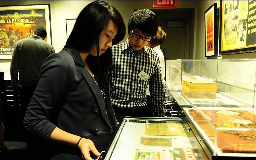 Bronx Science sophomores Theresa Wang and Justin Wu examine artifacts at the school's Holocaust Museum and Studies Center. (photo credit: Courtesy of Bronx Science High School)