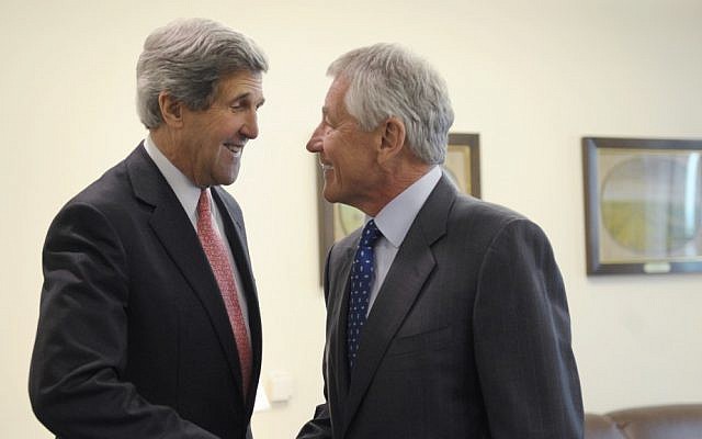 Defense Secretary Chuck Hagel, right, welcomes Secretary of State John Kerry, left, to his office at the Pentagon in Washington, Monday, May 6, 2013 (photo credit: AP/Susan Walsh)