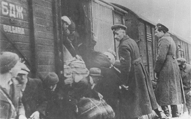 This image provided by the US Holocaust Memorial Museum shows Bulgarian policemen overseeing the deportation of Macedonian Jews to the German death camps in March 1943 in Bulgarian occupied Skopje. (AP Photo/U.S. Holocaust Memorial Museum, Courtesy of Jewish Historical Museum, Belgrade)
