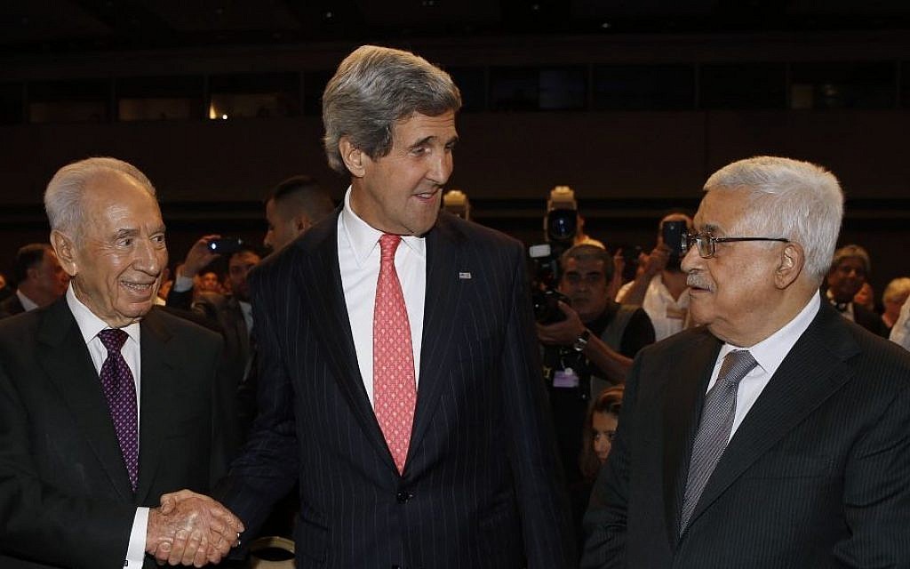 Secretary John Kerry with President Shimon Peres and Palestinian Authority President Mahmoud Abbas at the World Economic Forum in Jordan in late May 2013 (photo credit: AP)