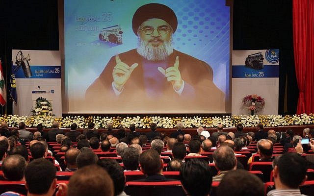 Hezbollah leader Sheik Hassan Nasrallah speaks via video during a conference, held in a southern suburb of Beirut, Lebanon, early May. (photo credit: AP/Hussein Malla)