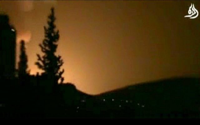 Smoke and fire fill the skyline over Damascus, Syria, early Sunday, May 5, 2013 after a reported Israeli airstrike. (AP Photo/Shaam News Network via AP video)