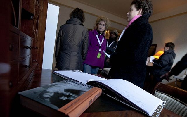 Anne Frank's diary is seen on her writing desk as visitors tour the first house of Anne Frank in Amsterdam, Netherlands, where the Frank family lived from 1933 to 1942. (photo credit: AP Photo/Peter Dejong, File)