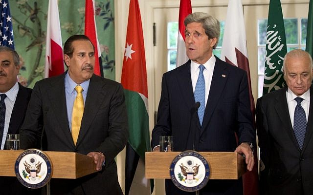 US Secretary of State John Kerry, second from right, with the Arab League lead by Qatar's Prime Minister and Foreign Minister Hamad bin Jassim bin Jabr Al-Thani, second from left, and Arab League Secretary-General Nabil Elaraby speaks to the media following their meeting at Blair House in Washington, Monday, April 29 (photo credit: AP/Manuel Balce Ceneta)
