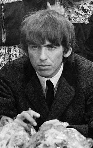 George Harrison during a press conference at Schiphol Airport, shortly after his arrival with the Beatles in the Netherlands in 1964 (photo credit: Nationaal Archief, Den Haag, Nederlands/Wikipedia Commons) 