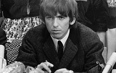 George Harrison during a press conference at Schiphol Airport, shortly after his arrival with the Beatles in the Netherlands in 1964 (photo credit: Nationaal Archief, Den Haag, Nederlands/Wikipedia Commons)