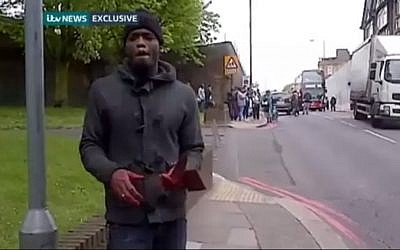Michael Adebolajo speaks to a cameraman shortly after attacking and killing Lee Rigby, last May (photo credit: YouTube screenshot)