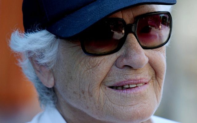 An elderly woman wears a cap reading 'Grandmother' (Illustrative photo credit: Moshe Shai/FLASH90)