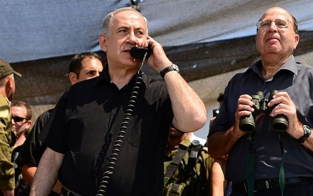 File: Prime Minister Benjamin Netanyahu and Defense Minister Moshe Ya'alon observe a drill of the Golani Brigade on the Golan Heights, Wednesday, June 26, 2013. (Kobi Gideon/GPO/Flash90)