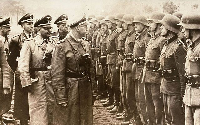 Heinrich Himmler, center, reviews troops of the Galician SS-Volunteer Infantry Division, June 3, 1944. (AP/US Holocaust Memorial Museum, Courtesy of Atlantic Foto Verlag Berlin)
