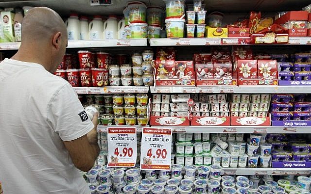 Illustrative: A man shops at a Rami Levy supermarket. (Nati Shohat/Flash90)