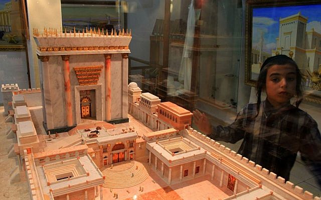 A young boy standing next to a model of the Second Temple at the Temple Insititute in Jerusalem. (photo credit: Nati Shohat/Flash90)