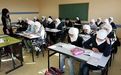 (Illustrative) Young Arab girls seen studying during a lesson in an East Jerusalem elementary school, December 13, 2011. (photo credit: Kobi Gideon/FLASH90)
