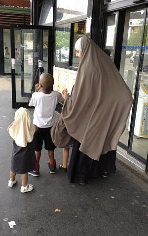 A veiled woman with her children in Trappes, southwest of Paris, Tuesday, July 23, 2013, (photo credit:AP/Elaine Ganley)