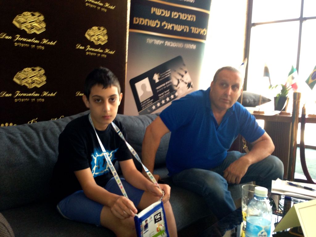Ariel Erenberg and his father, Shmulik, waiting for the next match (photo credit: Nicole Levin/Times of Israel)