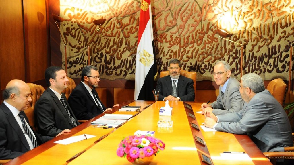 This image released by the office of the Egyptian Presidency on Monday, July 1, 2013, Mohammed Morsi, center, meets with members of his government leadership in Cairo, Egypt, Monday, July 1, 2013 (AP Photo/Egyptian Presidency)