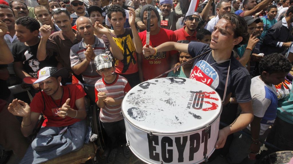 Egyptian protesters shout slogans and wave national flags during a demonstration against Egypt's Islamist President Mohammed Morsi in Tahrir Square in Cairo, Monday, July 1, 2013 (AP Photo/Amr Nabil)