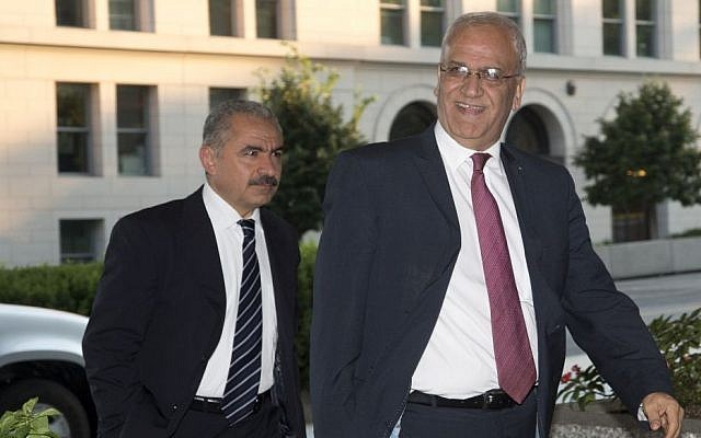 Saeb Erekat, right, Palestinian chief negotiator, and Mohammad Shtayyeh, left, arrive at the State Department in Washington, Monday, July 29, 2013. ( AP Photo/Pablo Martinez Monsivais)