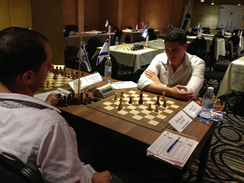 Two players finish up their match at the Open Tournament at the Maccabiah (photo credit: Nicole Levin/Times of Israel)