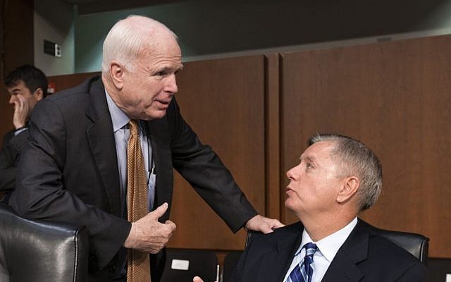US Senator John McCain, left, talks with Senator Lindsey Graham on Capitol Hill in Washington in July .(photo credit: AP/J. Scott Applewhite)