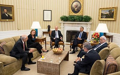 President Barack Obama and Vice President Joe Biden, along with Palestinian Chief Negotiator Saeb Erekat and Mohammed Shtayyeh (right) and  Israeli Justice Minister Tzipi Livni and Yitzhak Molho (left) at the formal resumption of direct Israeli-Palestinian negotiations, in the Oval Office, July 30, 2013. (photo credit: Official White House Photo, Chuck Kennedy)
