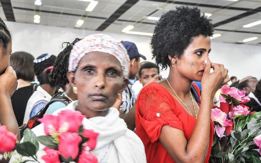 A mother waits for her son to arrive from Gondar on what Israel called the last flight of Falash Mura to the country in 2013 (photo credit: Michal Shmulovich/ToI)