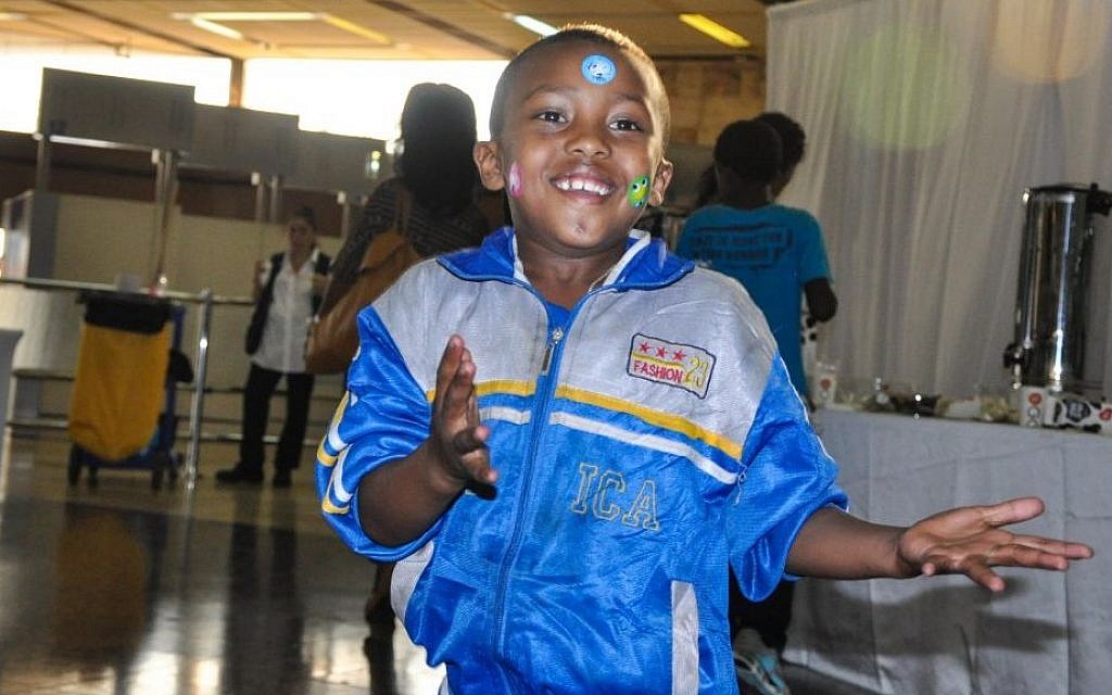 A young Ethiopian-Israeli dances for the arriving crowd of Falash Mura Wednesday (photo credit: Michal Shmulovich/ToI)