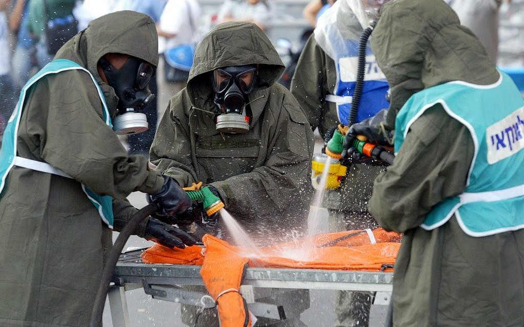 Illustrative photo of Israeli security personnel in chemical protection suits training during a chemical attack exercise in 2007. (photo credit: Roni Schutzer/Flash90)