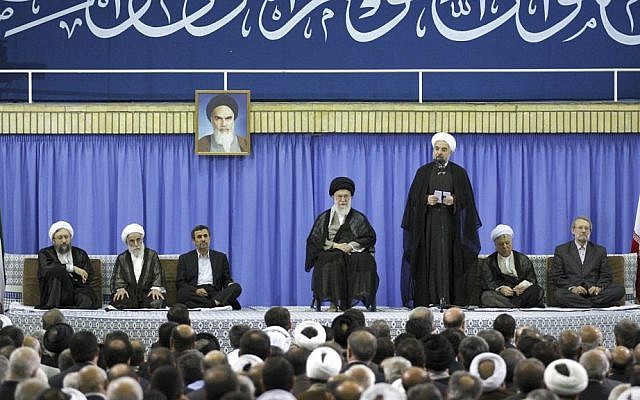 Iranian President Hassan Rouhani, third right, speaks, in an endorsement ceremony led by Supreme Leader Ayatollah Ali Khamenei, center, in Tehran, Iran on Saturday, August 3. (photo credit: AP/Office of the Iranian Supreme Leader)