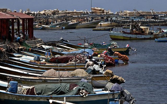 Palestinian boats wait to sail as they refuel at the fishermen sea port in Gaza City on Wednesday, July 31 (photo credit: AP/Adel Hana)