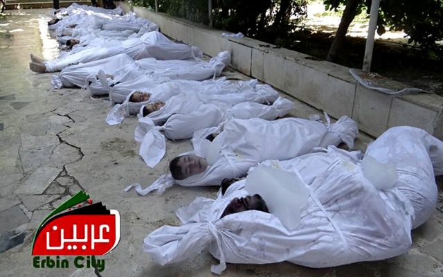 This citizen journalism image provided by the Local Committee of Arbeen which has been authenticated based on its contents and other AP reporting, shows dead bodies of Syrian citizens in Arbeen, near Damascus, on Wednesday. (photo credit: AP/Local Committee of Arbeen)