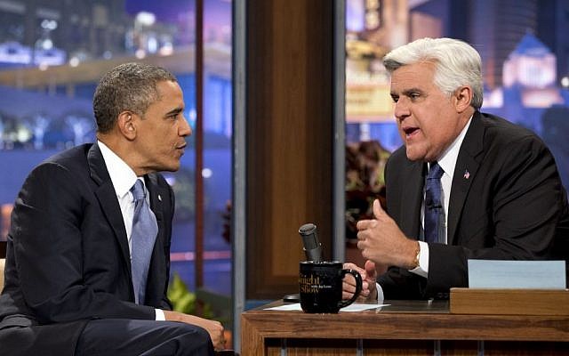 US President Barack Obama, left, talks with Jay Leno during a commercial break at a taping of “The Tonight Show with Jay Leno” in Los Angeles, in August 2013. (photo credit: AP/Jacquelyn Martin)