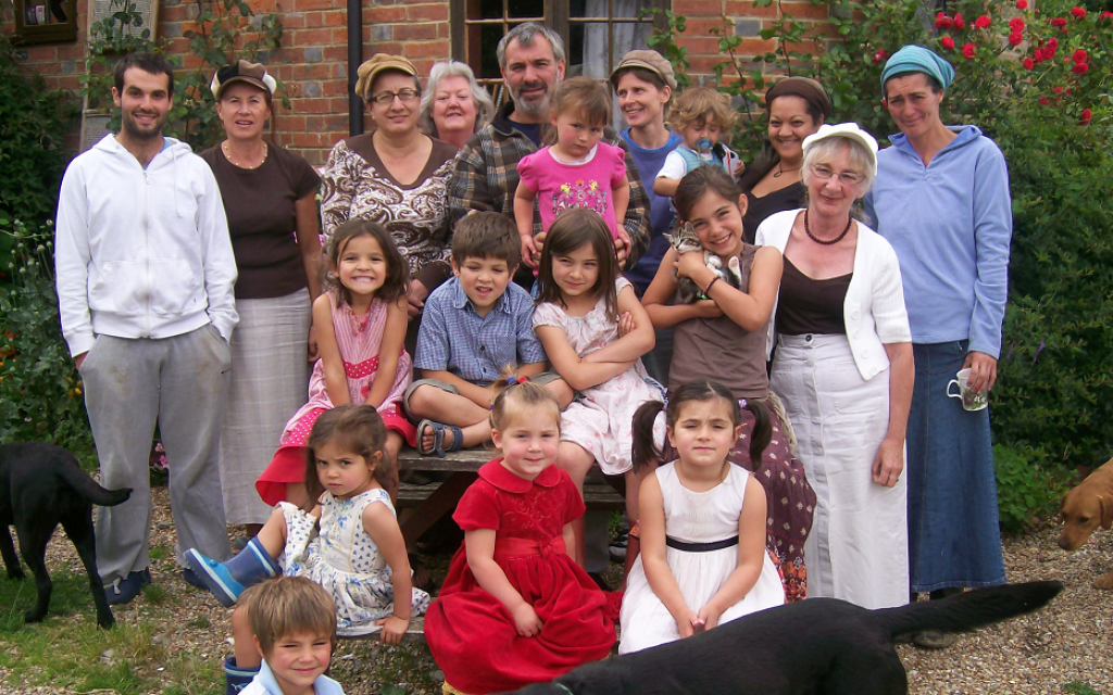 Philip Sharp (center), England's "Rampant Rabbi," has "married" six women and fathered 18 children, not all of whom are pictured here. (Courtesy of Judith Sharp)
