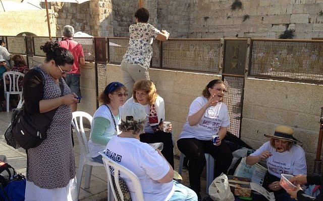 Anat Hoffman, center, among Women of the Wall supporters, during a sit-in to protest the government's erection of a temporary platform for egalitarian prayer, August 26, 2013 (photo credit: Raphael Ahren/TOI)