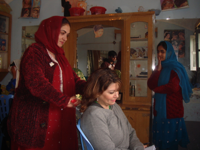Kingstone having her hair cut in Helmand, Afghanistan. (photo credit: Heidi Kingstone)