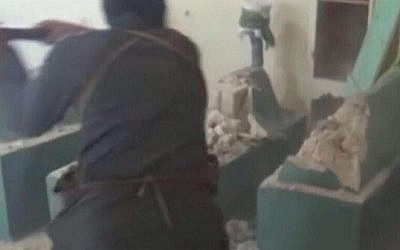 This image uploaded to Twitter on Wednesday is purportedly of al-Qaeda-linked terrorists demolishing ancient Jewish mausoleums in Aleppo, Syria (photo credit: @Yasmeena_Hedaya via Twitter)