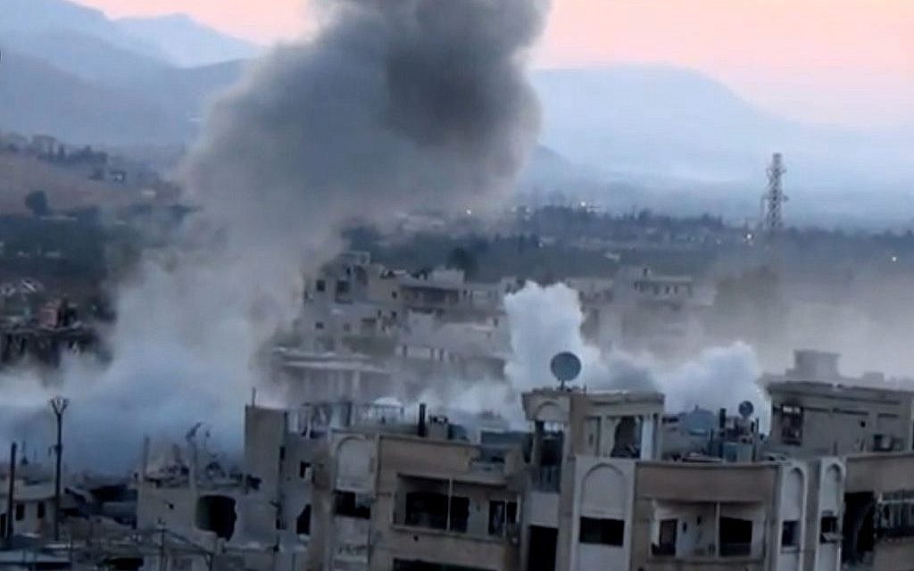 Smoke rises from buildings due to heavy artillery shelling in Barzeh, a district of Damascus, Syria, on Tuesday, September 10, 2013. (AP/Shaam News Network via AP video)
