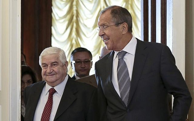 Russian Foreign Minister Sergey Lavrov welcomes his Syrian counterpart Walid Moallem (left), prior to talks in Moscow on Monday, September 9, 2013. (photo credit: AP/Ivan Sekretarev)
